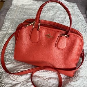 Vibrant grapefruit orange coach crossbody handbag